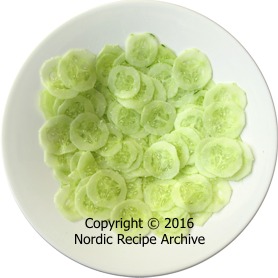 Cucumber slices and salt in a dish