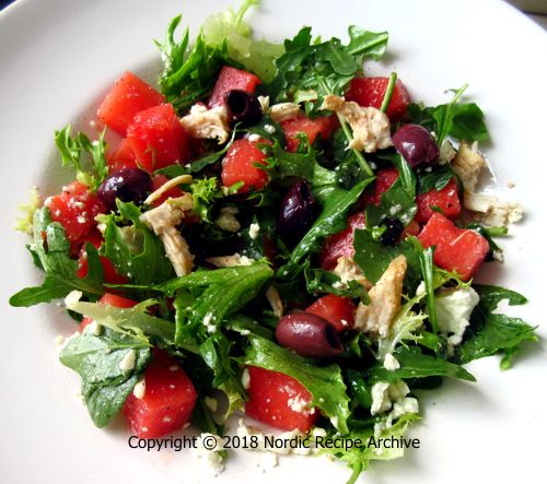 Watermelon salad with chicken and olives